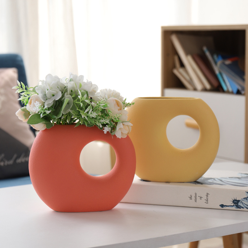 Coral and Yellow Donut Shaped Ceramic Vases with Flowers