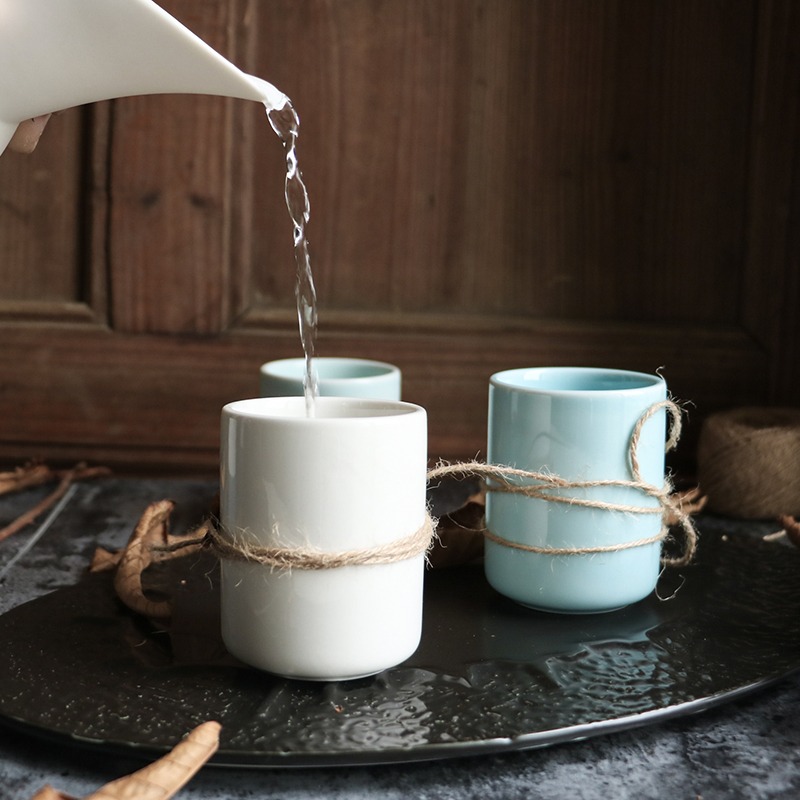 White and Sky Blue Ceramic Tumblers Tied with Twine