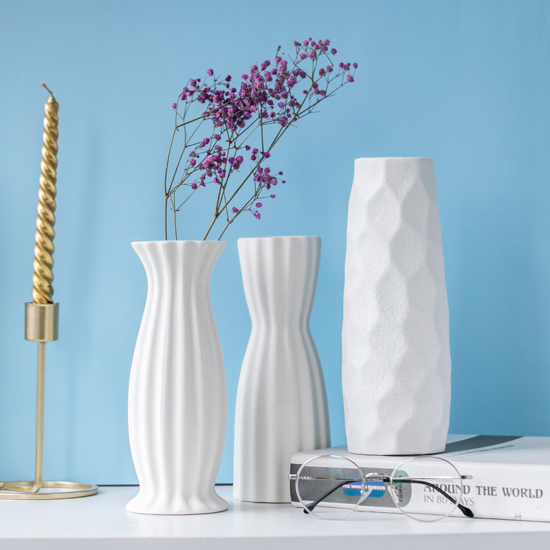 White Ribbed and Textured Ceramic Vases with Babys Breath